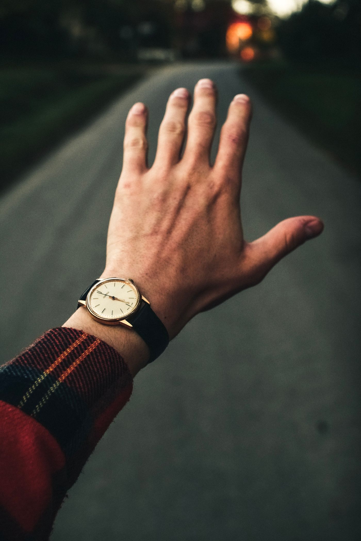 Analog watch worn outdoors in warm natural light